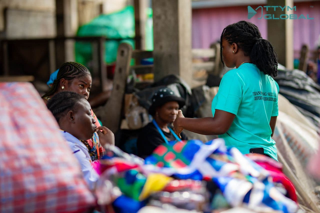 TTYM volunteer talking with women
